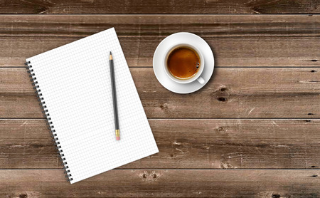 Empty paper with cup of coffee on wooden table.の写真素材