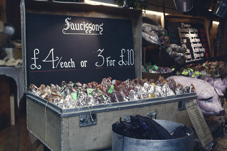 London,Uk - April 15, 2016: Sausages in a suitcase basket at Borough market in London, UK.のeditorial素材