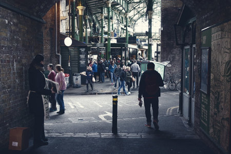 London,Uk - April 15, 2016: Visitors and shoppers in the covered section of Borough Market in...