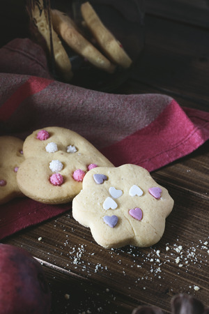 Homemade decorated cookies on wooden table.の写真素材