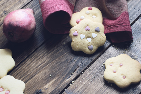 Homemade decorated cookies on wooden table.の写真素材