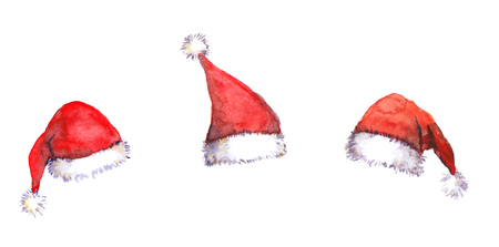 Three Christmas Santa red hats isolated, watercolorの写真素材