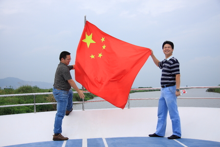 Yuhuan County of Zhejiang Province held the flag of tourists.のeditorial素材