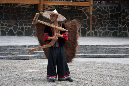 Performing in the traditional costume of Miao Ethnic
