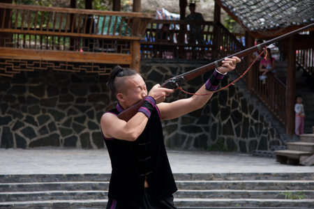 Performing in traditional costume of Miao ethnicのeditorial素材