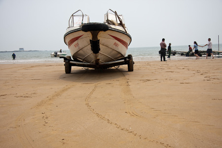 Workers working on the scenic spots of golden sand beachのeditorial素材