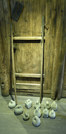 Stone scales and weight collected in Creek town, xiapu County, Fujian province, "the she nationality Folk Museum"のeditorial素材