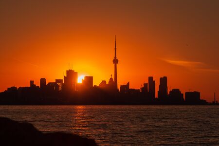 Toronto sunrise skyline with red and orange daybreak lightの写真素材