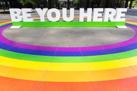 Toronto, Ontario, Canada - June 22, 2019: LGBT Pride Month. BE YOU HERE art installation with LGBT rainbow flagのeditorial素材