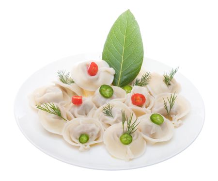 Russian meat dumplings aka pelmeni on the white plate isolated on the white backgroundの写真素材