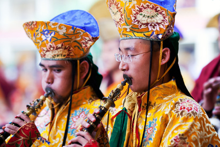 KATHMANDU, NEPAL - MARCH 25: Buddhist monks playing music during Cham mystery at Shechen monastery on March 25, 2010 in Kathmandu, Nepal. Cham is a form of meditation and an offering to the gods.のeditorial素材