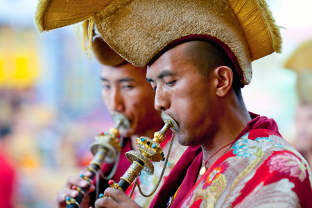KATHMANDU, NEPAL - MARCH 25: Buddhist monks playing music during Cham mystery at Shechen monastery on March 25, 2010 in Kathmandu, Nepal. Cham is a form of meditation and an offering to the gods.のeditorial素材