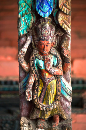 Ancient Nepalese wooden carving at the column of a temple on Durbar Square in Bhaktapur, Kathmandu valley, Nepalのeditorial素材