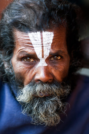 KATHMANDU, NEPAL - JANUARY 9: Shaiva sadhu seeks alms on the street on January 9, 2010 in Kathmandu,...