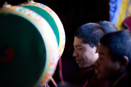GORKHA, NEPAL - NOVEMBER 28: Buddhist monk during puja ceremony in a monastery on November 28, 2009 in Gorkha District, Nepal.のeditorial素材