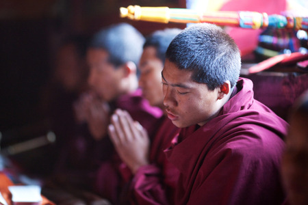 GORKHA, NEPAL - NOVEMBER 28: Buddhist monk during puja ceremony in a monastery on November 28, 2009 in Gorkha District, Nepal.のeditorial素材