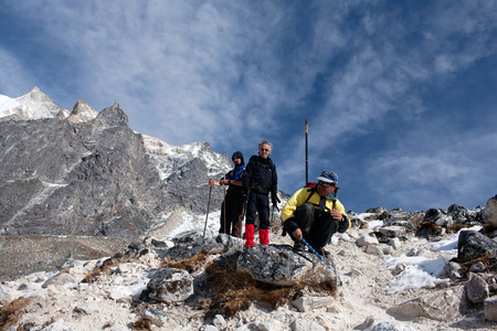 GORKHA, NEPAL - DECEMBER 02: Trekking in the Manaslu region. Two trekkers ang sherpa guide on the Larke Pass on December 02, 2009 in Gorkha District, Manaslu Area, Nepal.のeditorial素材