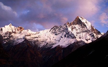 Mount Machapuchare Fishtail at sunset, view from Annapurna base camp. Machapuchare or Machhaphuchhare is a mountain in the Annapurna Himal of north Central Nepal.の写真素材