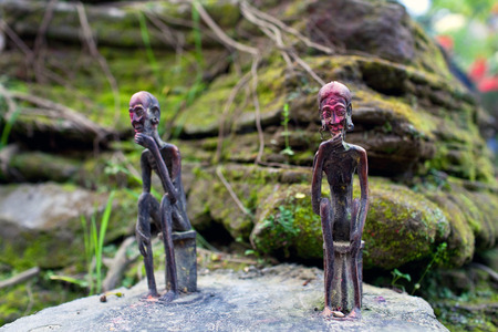 Old small statuettes of local guardian spirits near holy Gupteshwor Mahadev cave in Pokhara, Nepalの写真素材