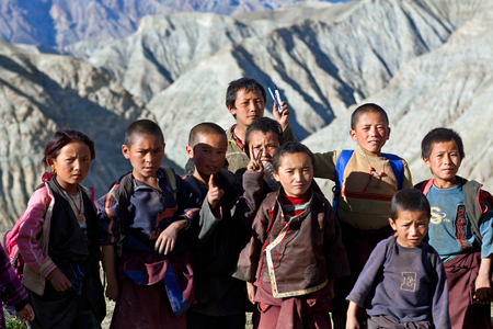 SALDANG - SEPTEMBER 06: Group of Tibetan students from the village of refugees poses for a photo during their break time on September 06, 2011 in Saldang, Upper Dolpo, Nepalのeditorial素材