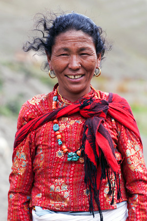 DHO TARAP, NEPAL - SEPTEMBER 10, 2011: Tibetan woman working in the fields in Dho Tarap, Upper Dolpo, Nepalのeditorial素材