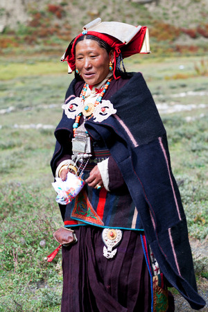 DHO TARAP, DOLPO, NEPAL - SEPTEMBER 11: Tibetan women in national clothes poses for a photo during Dho Tarap Full Moon Festival on September 11, 2011 in Dho Tarap village, Dolpo district, Nepalのeditorial素材