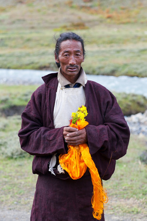 DHO TARAP, DOLPO, NEPAL - SEPTEMBER 11, 2011: Tibetan man in traditional clothes poses for a photo during Dho Tarap Full Moon Festival in Dho Tarap village, Nepal. In Tibetan Buddhism and Bon, a Ngakpa is a person who has received mantrayana vows and devoのeditorial素材