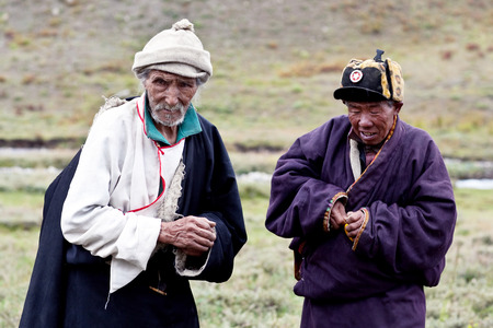 DHO TARAP, NEPAL - SEPTEMBER 11, 2011: Tibetan nomads in national clothes posing for the photo during the local Dho Tarap Full Moon Festival in Dho Tarap Village, Dolpo district, Nepalのeditorial素材