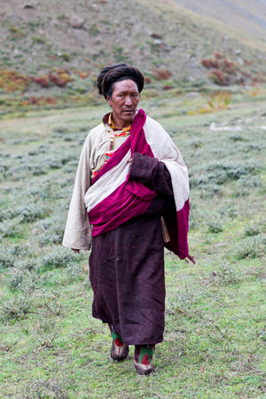 DHO TARAP, DOLPO, NEPAL - SEPTEMBER 11, 2011: Ngakpa man in traditional clothes waiting for Puja...
