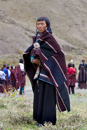 DHO TARAP, NEPAL - SEPTEMBER 11: Tibetan woman posing for the photo during the local Dho Tarap Full Moon Festival on September 11, 2011 in Dho Tarap Village, Dolpo district, Nepalのeditorial素材