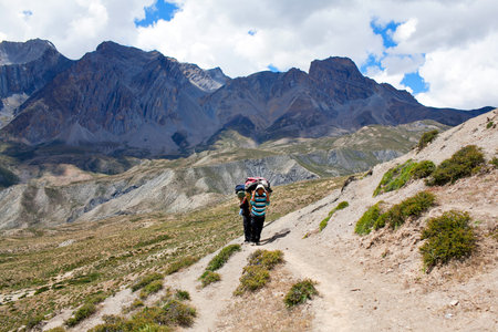 Porters with heavy load at the Pass on September 13, 2011 in Upper Dolpo restricted area, Nepalのeditorial素材