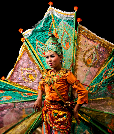 YANGON, MYANMAR - JANUARY 25, 2011: Burmese girl performing traditional Peakock Dance on the evening show in Karaweik Hall.のeditorial素材