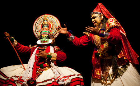 VARKALA, INDIA - FEBRUARY 10, 2010: Kathakali actors performing on the evening show in Varkala, Kerala, South India. Kathakali is the ancient classical dance form of Kerala.のeditorial素材