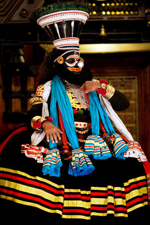 FORT COCHIN, INDIA - FEBRUARY 14, 2010: Actor performing traditional Indian dance-drama Kathakali in in Fort Cochin, South India. Kathakali - the classical dance-drama of Kerala based on Indian mythology, and noted for its elaborate costumes and gestures.のeditorial素材