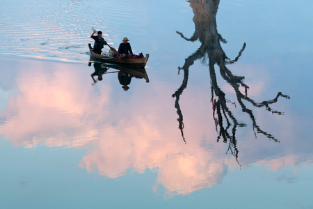 AMARAPURA, MYANMAR - JANUARY 12: Burmese men fishing on Thaungthaman Lake on January 12, 2011 in Amarapura, Mandalay Division, Myanmarのeditorial素材