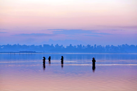 Sunrise on Thaungthaman lake in Amarapura, Myanmarの写真素材