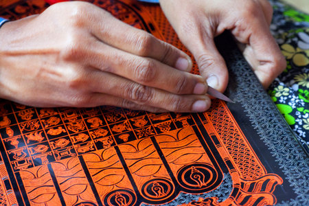 NYAUNG U, MYANMAR - JANUARY 5: A woman works in a factory of lacquer on January 5, 2011 in Nyaung U...
