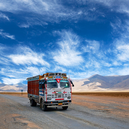 LADAKH, INDIA - JUNE 10, 2012: Indian truck driving in the Indian Himalayas on Manali - Leh National highway in Ladakh, Jammu and Kashmir state, North India. Indian and Pakistani truckers consider their vehicles as national symbols and make it a competitiのeditorial素材