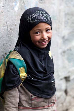 TURTUK, INDIA - JUNE 13: Balti shoolgirl poses for a photo during her break time on June 13, 2012 in Turtuk Village, Ladakh, India. Turtuk village opened to foreign tourists in 2010.のeditorial素材