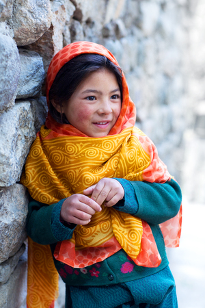 TURTUK, INDIA - JUNE 13, 2012: Shoolgirl from Baltistan poses for a photo during her break time in Turtuk Village, Ladakh, Indiaのeditorial素材