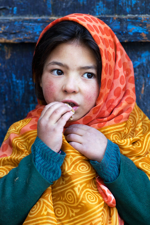 TURTUK, INDIA - JUNE 13, 2012: Shoolgirl from Baltistan poses for a photo during her break time in Turtuk Village, Ladakh, Indiaのeditorial素材