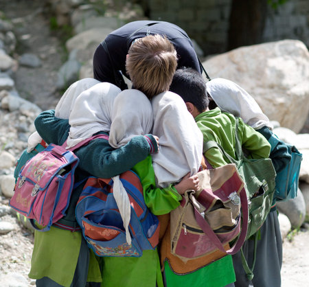 TURTUK, INDIA - JUNE 13, 2012: Children from Baltistan poses for a photo during her break time in Turtuk Village, Ladakh, Indiaのeditorial素材