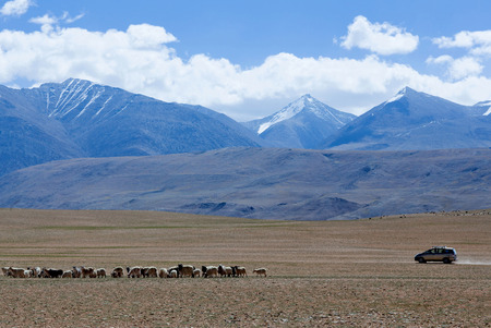 LADAKH, INDIA - JUNE 20, 2012: Off-road vehicle driving in the Indian Himalayas in Ladakh, Jammu and Kashmir state, North Indiaのeditorial素材
