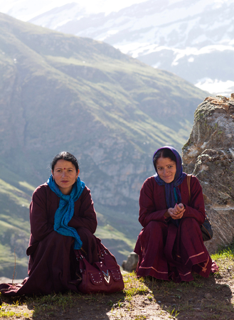 LADAKH, INDIA - JUNE 9, 2012: Women poses for a photo on the road from Manali to Leh in Ladakh, Jammu and Kashmir State, North Indiaのeditorial素材