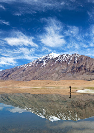 An unidentified photographer walking on Thatsang Karu lake in Ladakh, Jammu and Kashmir State, India