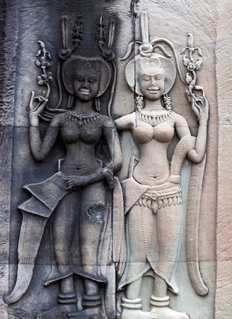 AAncient bas-relief at the facade of Angkor Wat in Angkor, Cambodia. Angkor Wat, was built between...