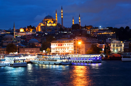 View from Galata Bridge to Suleymanie Mosque in Istanbul, Turkey by Night.の写真素材