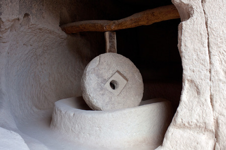 Ancient millstone in Zelve Open Air Museum in Cappadocia, Turkey. This process is being made by means of a stone 500 kg weight and 1,5 m. diameter moving by a rotation mechanism.のeditorial素材