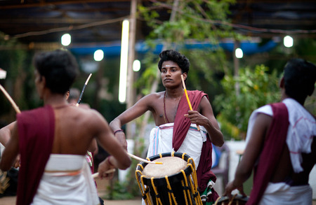 KERALA, INDIA - JANUARY 15, 2016: Indian drummers playing Chenda drums during Theyyam ceremonyのeditorial素材