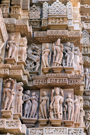 Ancient bas-relief at famous erotic temple in Khajuraho, India. Most Khajuraho temples were built between 950 and 1050 by the Chandela dynasty.の写真素材